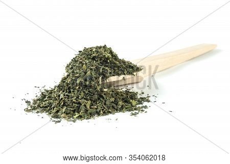 Dried Nettle Herb Or In Latin Utricae Folium In Wooden Spoon Isolated On White Background. Medicinal