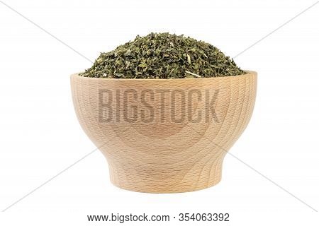 Dried Nettle Herb Or In Latin Utricae Folium In Wooden Bowl Isolated On White Background. Medicinal 