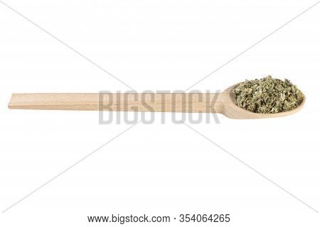 Dried Artichoke Leaves Or In Latin Cynarae Folium In Wooden Spoon Isolated On White Background. Medi