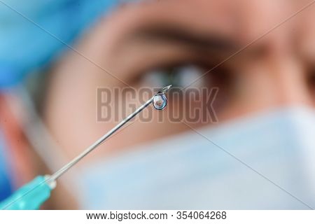 Injection. Immunization. Antibiotics. Doctor With Syringe Preparing For Injection. Doctor Makes Vacc
