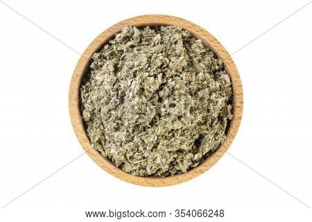 Dried Artichoke Leaves Or In Latin Cynarae Folium In Wooden Bowl Isolated On White Background. Medic