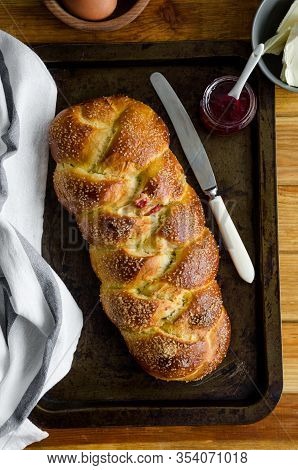 Traditional Sweet Easter Bread With Raisins, Dried Cherries On An Old Baking Tray Jam And Butter. Co