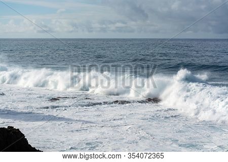 Dangerious Ocean Stormy Waves Hits Black Lava Rocks By Faro De Las Hoyas, La Palma Island, Canary, S