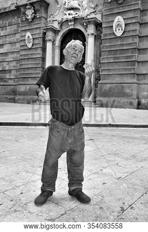 A Mazarese Fisherman Tells Anecdotes Of His Life In Front Of The Cathedral, 20 Sep 2019 Mazara Del V