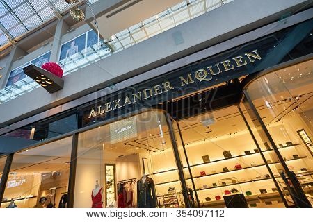 SINGAPORE - JANUARY 20, 2020: Alexander McQueen brand name over a store entrance in the Shoppes at Marina Bay Sands. Alexander McQueen is a British luxury fashion house.