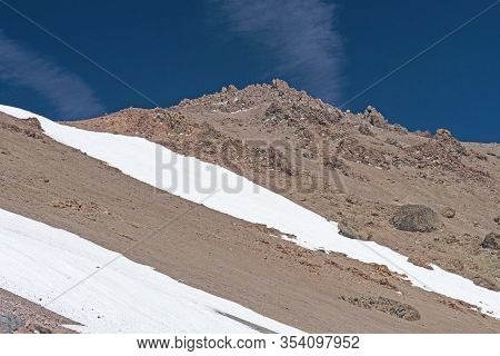 Snow And Bare Rock On A Mount Lassen In Lassen Volcanic National Park In California