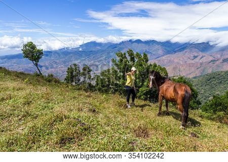 Local Costa Rican Woman With Her Horse High In The Mountains Of Costa Rica