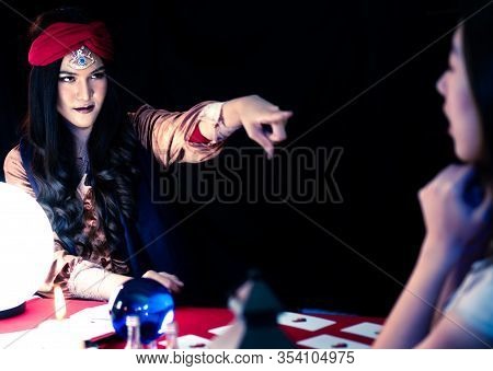 A Black Woman Dressed As A Witch Performs A Ritual In A Mysterious, Horrifying, And Abrupt Room. Cry