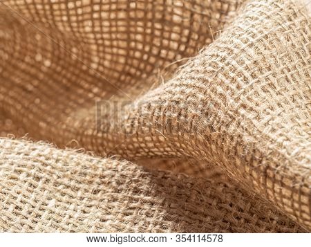 Brown Burlap Textile. Crumpled Sackcloth, Close Up View. Texture Of Burlap Fabric. Brown Baline, Abs