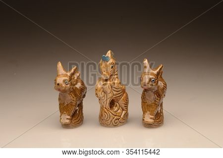 Three Ceramic Horses And Rabbits Miniature Photographed In A Photo Studio Using A Light Source, The 