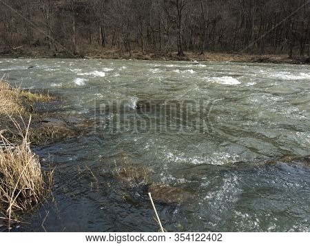 Boiling Water Of A Mountain Fast River In The Mountains In Spring, Big Stones. Nature Landscape Scen