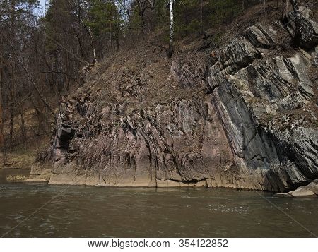 Calm Yellow River, Unusual Rocks, Mountains. Natural Landscape. View From The Water