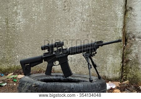 Modern AR15 rifle with a sight aim. Unformal shooting range near Kiev. Former Soviet military base.March 4, 2020. Kiev Region, Ukraine