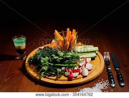 Fresh Chopped Vegetables On A Wooden Board.