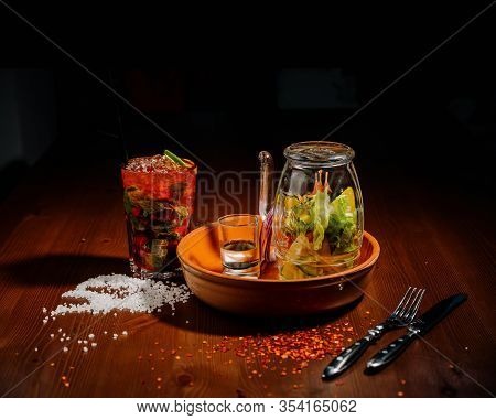 A Glass Teapot With Tea And A Glass Cup With Tea Stand On The Table