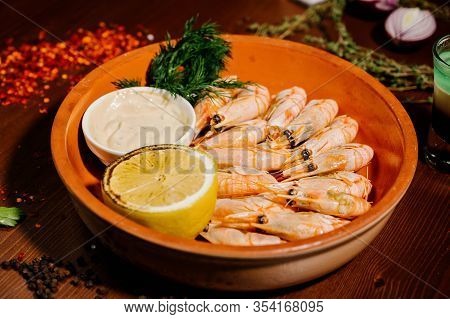 Grilled Shrimps Or Prawns Served With Lemon And Sauce