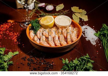 Grilled Shrimps Or Prawns Served With Lemon And Sauce