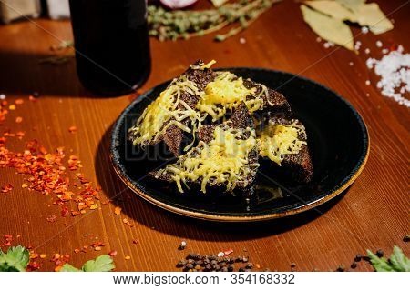 Rusks With Cheese, Leek, Sauce On A Wooden Old Table