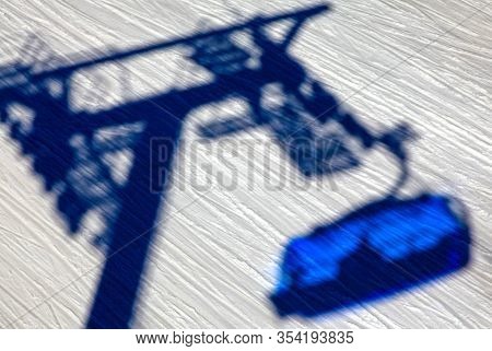 Shadow Of Ski Lift Chair On Snow At Slope