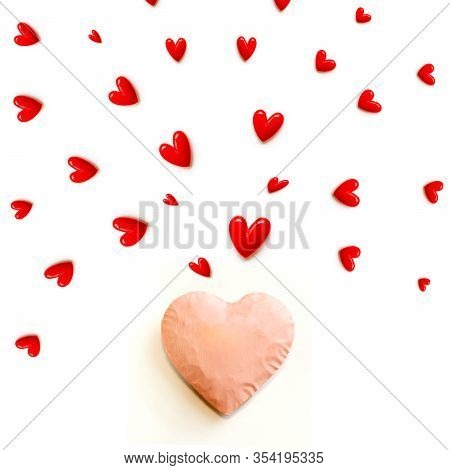 The Red Small Hearts Overflow Around The Pink Heart, And Fly Upwind.and Pink Background And Copy Spa