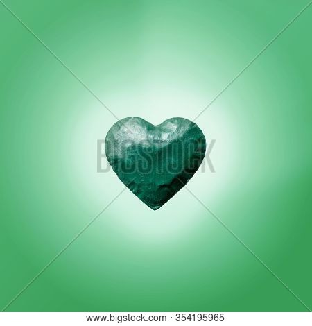 Energy Of The Light Comes Out Of Big Green Heart And Copy Space. Bright Gteen Background.flat Lay.