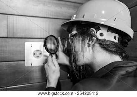 Selective Focus On Construction Inspector Womans Hand Holding A Magnifying Glass To Looking Closely 