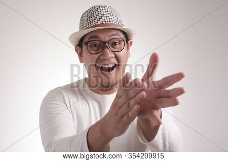 Happy Young Man Clapping Hands