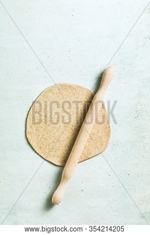 Cooking Dough For Pita Bread On A Table In A Glass Bowl, Rolling Pin And Knife