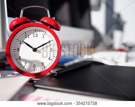 Alarm Clock Is On Desktop, Close-up Watch Dial. Optimal Allocation Resources To Achieve Your Goals. 