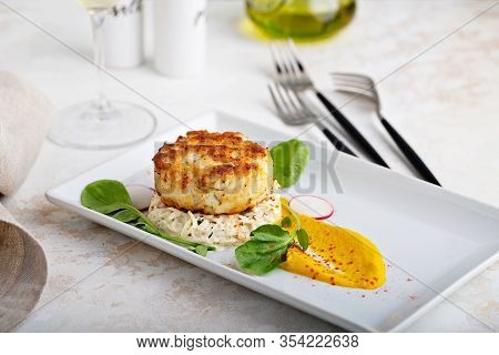 Gourmet Plated Fishcake Or Crabcake With Vegetable Puree, Restaurant Food