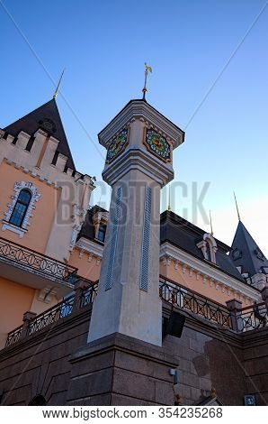 Wide-angle Landscape View Of Fairytale Tower With Clock Of Kyiv Academic Puppet Theatre During Sunri