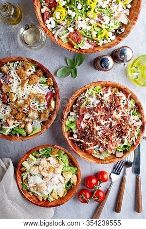 Variety Of Restaurant Style Salads With Caesar, Greek And Cobb