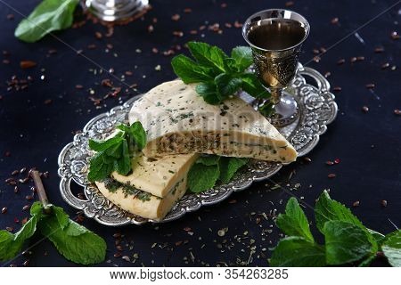 Halumi Cheese With Mint On A Vintage Tray With Vintage Silver-plated Accessories. Photo On A Black B