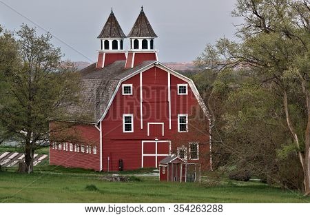 Granddaddy Of All Barns Proudly Showing Off Its Colors At Sundown