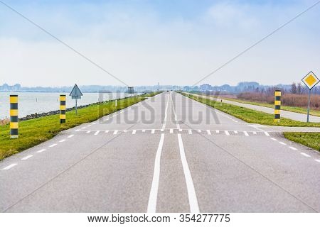 The Road N701 Between Almere And Lelystad In Netherlands Splitting Nature Reservation And Markermeer