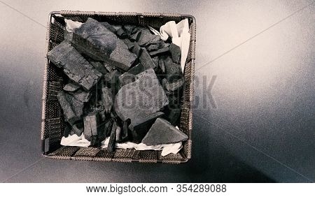 Black Wooden Charcoal On Black Background Top View