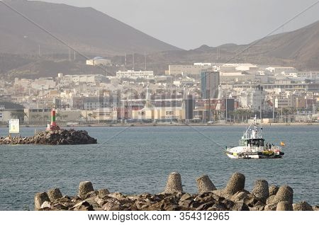 Breakwater, Lighthouse And Boat In The Port Of Las Palmas Or La Luz Port. Las Palmas De Gran Canaria