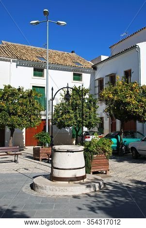 Estepa, Spain - November 13, 2008 - Water Well And Orange Trees In The Plaza De La Victoria, Estepa,