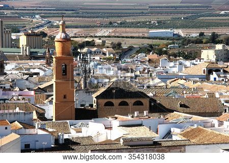 Osuna, Spain - November 13, 2008 - Elevated View Over The Town Rooftops And St Charles Church (igles
