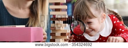 Caucasian Little Girl Hand Hold Magnifier Lens. Information Internet Search Concept. Parental Contro