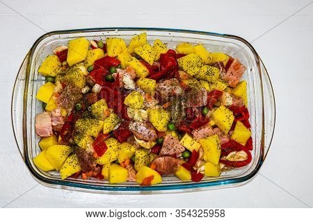 Raw Vegetables ( Potatoes, Carrots, Green Peas, Red Pepper And Onion) With Pork Meat Garlic And Spic