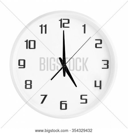 White Round Office Clock Showing Five Oclock Isolated On White Background.