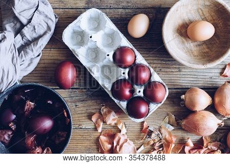 Dyed Easter Eggs Painted With Natural Dye Onion On Rustic Wooden Background. Process Of Dyeing Eggs 