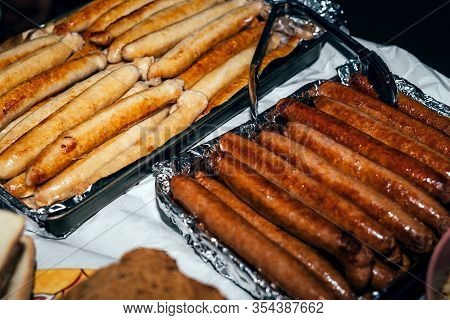 Grillied Barbecue Sausages On Table In The Garden. Chicken And Beef Sausages. Public Bbq Place In Au
