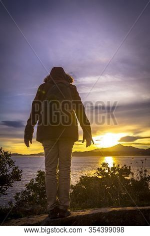 A Young Man At Dawn In The Town Of Fuenterrabia In Winter. Basque Country