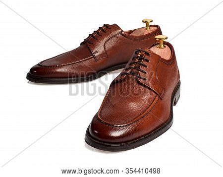 Isolated Brown Male Shoes With Hilders On White Background.