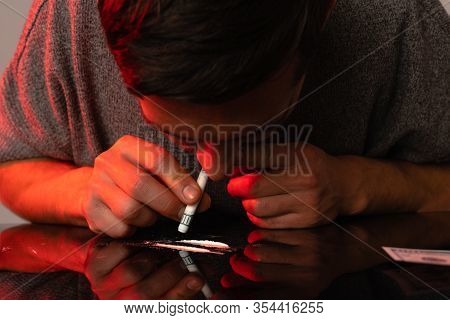 Addict In Depression Smells Cocain Trace, Studio Photo