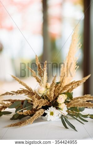 A Bouquet Of Roses Flowers, Chrysanthemum And Fluffy Pikelets In Rustic Style