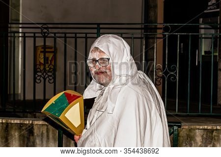 Puget-theniers, France - February 26, 2020: A Participant Of The Traditional Annual Parade Of White