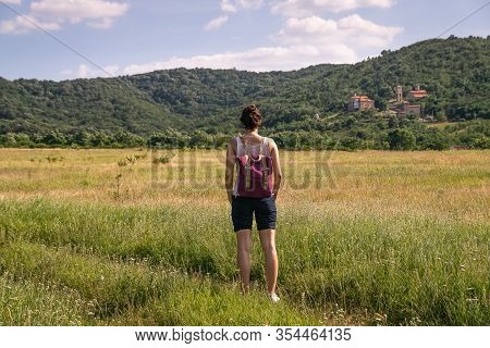 Woman In Meadow Nature In Vacation. Woman In Nature. Green Fields In Nature. Vacation. Natural Envir